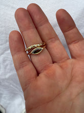 Load image into Gallery viewer, Gold ring on a finger against a white background
